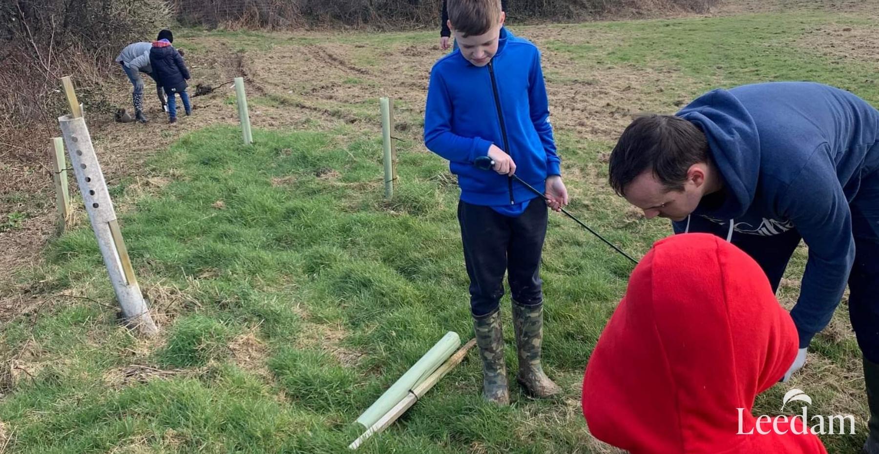 Planting the tree at Pembrokeshire natural burial ground