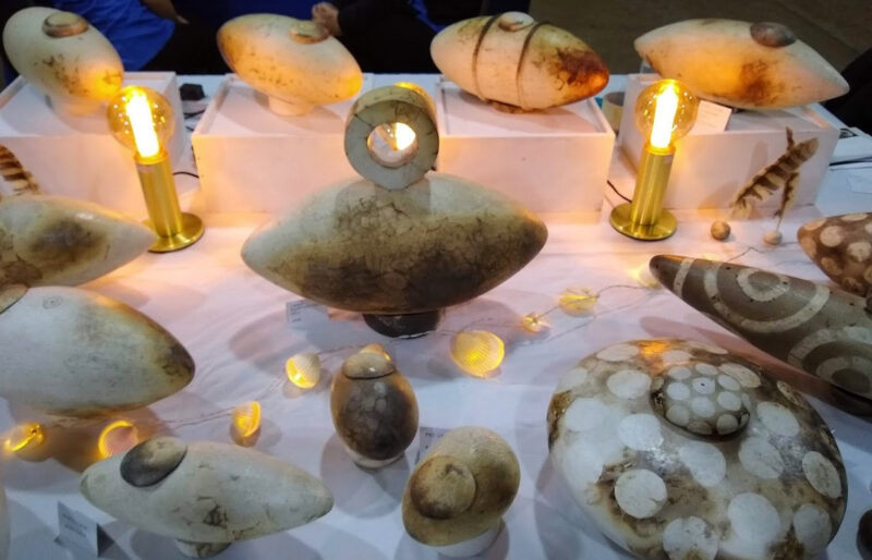 Handmade Ceramic Urns on a table with candles.