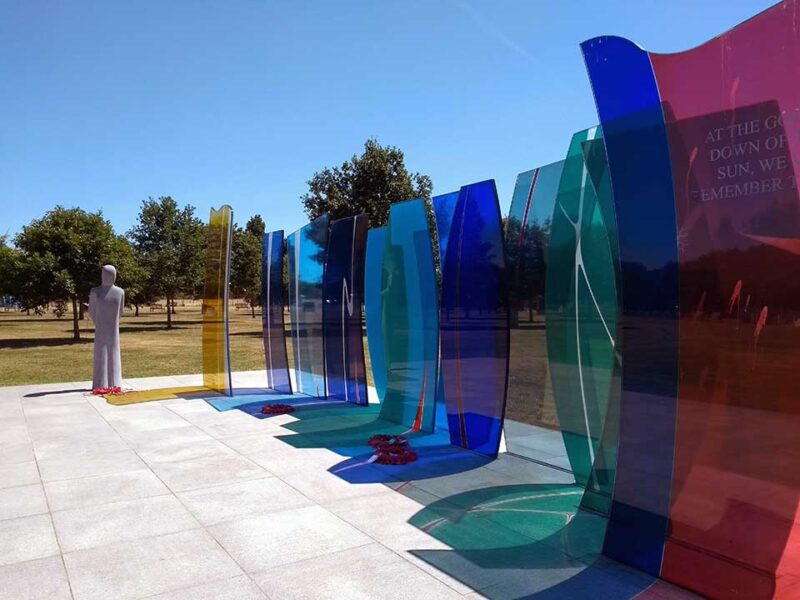 Photo of multi coloured statues at National Memorial Arboretum